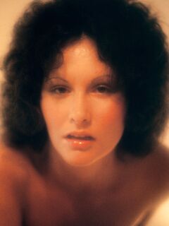 Classic retro centerfold Linda Lovelace enjoys solo masturbation on her bed