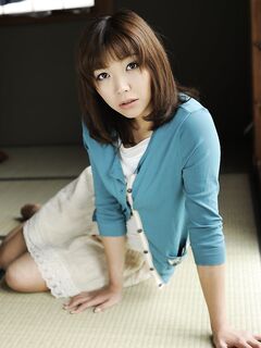 Japanese solo girl Juri Kitahara tentatively shows her trimmed pussy